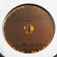 Image for article titled This Tiny Coin Contains a Microscopic Archive of 1,000 Different Languages